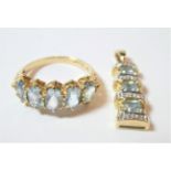 A 9 carat gold aquamarine five stone ring, finger size P; and a 9 carat gold aquamarine and