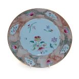 A Chinese export dish painted with flowers