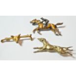 An enamel and marcasite horse and jockey brooch, stamped 'SILVER', length 5.2cm; a hound brooch,