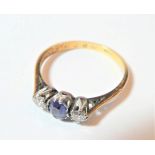 A sapphire and diamond three stone ring, finger size O. Engraved to the inner shank. Stamped '&