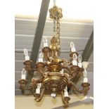 A brass twelve light chandelier (a.f.)