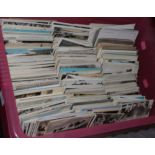 Postcards collection in a large plastic box, with mainly middle period UK and Foreign cards, some