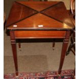 An Edwardian mahogany envelope card table 60.5cm closed by 74cm high.