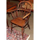 A 19th century ash and elm Windsor armchair, with crinoline stretcher