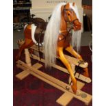 A modern rocking horse, the base with metal plaque stamped Rocking Horse Makers and Restorers