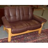 Wood framed brown leather Ekornes two seater sofa