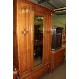 An early 20th century carved oak two-piece bedroom suite
