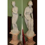 Two large bisque style figures of maidens on faux pink marble basesAppear in good condition. These