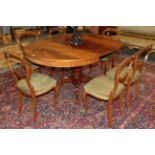 A reproduction mahogany pedestal dining table and six Victorian balloon back chairs (a.f.)