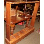 A 20th century beech campaign rifle stand, the C scroll top support with five pierced apertures