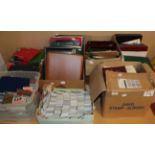 Nine boxes of stamps and phone cards