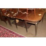 A Regency style mahogany D end dining table, composed of two D end tables, a central gateleg table