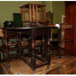 A 19th century oak gate leg table, a small desktop oak revolving book stand, and a three tier what-