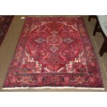 Heriz Rug, the crimson field with cruciform medallion framed by samovar motif borders, 186cm by