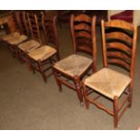 Six ash and elm rush seated ladder back chairs (6)