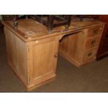 A 19th century pine pedestal desk