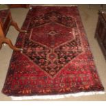 Hamadan rug, the charcoal field with serrated medallion framed by spandrels and narrow borders,