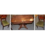 A mid 19th century mahogany fold over tea table on an X-form platform base, raised on paw feet,