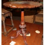 A Victorian mahogany tripod table, with pie-crust decorated top