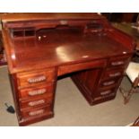 An early 20th century mahogany roll top desk with brass plaque impressed Feige Desk Company, USA