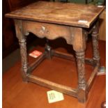 A carved oak joined stool, in 17th century style, the rectangular top above a wavy shaped apron with