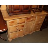 A Victorian pine sideboard with upstand