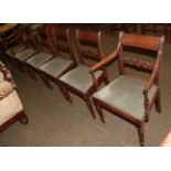 A set of six Regency mahogany dining chairs, circa 1820, including two carvers with reeded