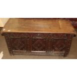 An 18th century carved oak coffer