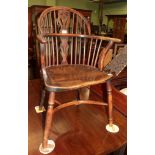 A 19th century yew wood Windsor chair, with elm moulded seat