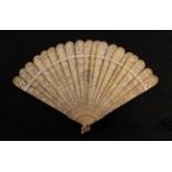 A circa 1840's Chinese carved ivory brisé fan, Qing Dynasty, the nineteen inner sticks well carved