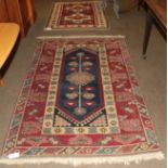 Kars rug, the raspberry field with two cruciform medallions enclosed by stellar motif borders