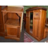 A late Victorian walnut triple door wardrobe, 183cm wide; together with a similar bedside