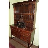 A 1920's carved oak Welsh dresser, 120cm wide