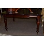 A Victorian mahogany extending dining table, with an additional later leaf, 135cm extended