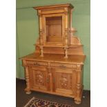 A late 19th century Danish pine sideboard, glazed cabinet over base with two cushion drawers above