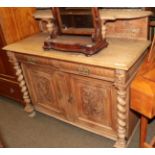 A late 19th century carved oak sideboard, rectangular moulded top with galleried back, two cushion