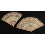 Two early 19th European brisé fans, both with slender guards, both carved and pierced in quite