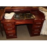 An early 20th century mahogany roll top desk with brass plaque impressed ''Feige Desk Company,
