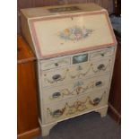 A late 19th century cream painted bureau, in the Neo Classical style, 61cm wide