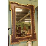 A George III style mahogany and gilt bevelled glass wall mirror, with an egg and dart moulded frame,