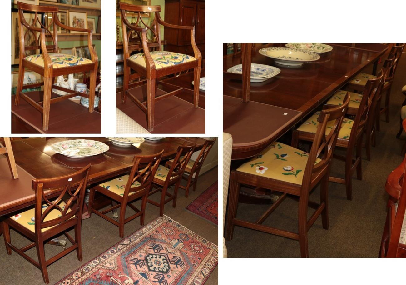 A set of ten reproduction mahogany dining chairs, including two carvers