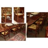 A set of ten reproduction mahogany dining chairs, including two carvers