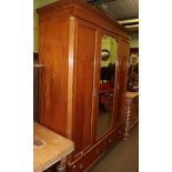 A Waring and Gillows two door satinwood wardrobe, stamped and labelled, 160cm wide