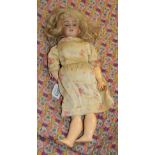 German S&H 1249 small bisque socket head doll, with blond hair wearing a floral dress