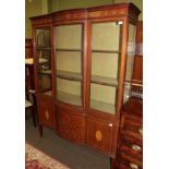 An Edwardian mahogany and marquetry inlaid bow fronted display cabinet, 128cm wide