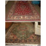 A Ghom style carpet, the crimson field with central medallion enclosed by ivory borders, 312cm by
