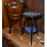 An oak and brass bound planter of staved construction, 69cm high; and an Arts and Crafts ebonised