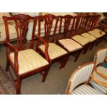 A set of eight reproduction Chippendale style hardwood dining chairs, including two carvers