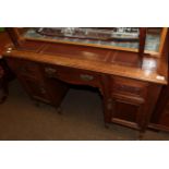 An Edwardian walnut leather top writing desk, 121cm wide