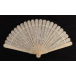 A circa 1840's Chinese carved ivory brisé fan, Qing Dynasty, with 21 inner sticks and two guards,